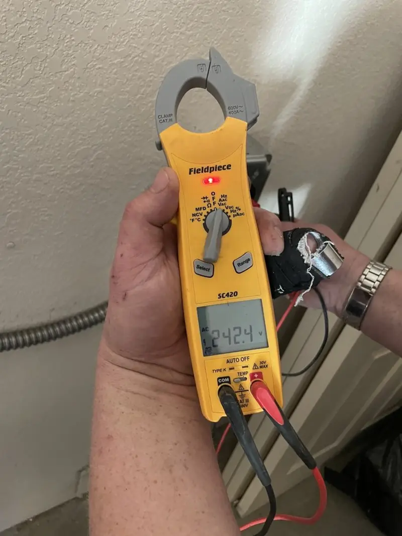 Voltage testing with clamp meter during Circuit Breaker Repair in Woodmoor